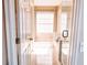Bright, white bathroom featuring tiled floor and glass enclosed shower at 8556 Tidal Bay Ln, Tampa, FL 33635