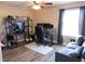 Bedroom boasts a computer setup, sofa, and modern ceiling fan at 8556 Tidal Bay Ln, Tampa, FL 33635