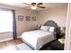 Comfortable bedroom featuring a decorative headboard, ceiling fan and ample natural light at 8556 Tidal Bay Ln, Tampa, FL 33635