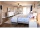 This bedroom features a king bed, vanity, ceiling fan, and bright lighting at 8556 Tidal Bay Ln, Tampa, FL 33635