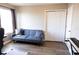 Bedroom with futon sofa, closet, and window for bright, comfortable living at 8556 Tidal Bay Ln, Tampa, FL 33635