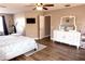 Bedroom featuring a flat-screen TV, closet, and vanity at 8556 Tidal Bay Ln, Tampa, FL 33635
