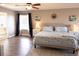 Spacious bedroom featuring a large bed and ensuite bathroom at 8556 Tidal Bay Ln, Tampa, FL 33635