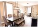 Well-lit dining room with modern lighting, comfortable seating, and stylish decor at 8556 Tidal Bay Ln, Tampa, FL 33635
