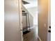 Inviting entryway with wood floors, coat rack, and access to the staircase at 8556 Tidal Bay Ln, Tampa, FL 33635