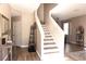 Inviting entryway with wood floors, a staircase, and neutral decor creating a warm welcome at 8556 Tidal Bay Ln, Tampa, FL 33635