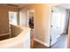 Upstairs hallway featuring access to bedrooms and closets with wood-look floors at 8556 Tidal Bay Ln, Tampa, FL 33635