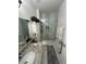 Elegant bathroom showcasing a glass shower, modern vanity, and refined design at 8603 Egret Point Ct, Tampa, FL 33647
