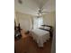 Comfortable bedroom with ceiling fan, ample natural light, and closet at 8603 Egret Point Ct, Tampa, FL 33647