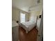 Calm bedroom features wooden floors, soft lighting, and minimalist decor at 8603 Egret Point Ct, Tampa, FL 33647