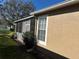 The exterior view shows a window with white trim and a screened in enclosure at 8603 Egret Point Ct, Tampa, FL 33647