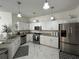 Well-equipped kitchen features stainless steel appliances, granite countertops, and ample cabinet space at 8603 Egret Point Ct, Tampa, FL 33647