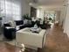 Bright living room with modern decor, large windows, and an open layout at 8603 Egret Point Ct, Tampa, FL 33647