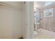 This bathroom features a pedestal sink, toilet, and a shower with a window at 8792 93Rd St, Seminole, FL 33777
