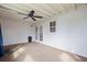 Sunroom with ceiling fan, carpet, and white walls with french doors and a window at 8792 93Rd St, Seminole, FL 33777