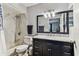 Updated bathroom with shower over tub featuring elegant fixtures and vanity at 9481 Highland Oak Dr # 404, Tampa, FL 33647