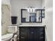 Updated bathroom with shower over tub featuring elegant fixtures and vanity at 9481 Highland Oak Dr # 404, Tampa, FL 33647