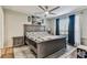 Spacious bedroom with ceiling fan, large window, and a plush rug at 9481 Highland Oak Dr # 404, Tampa, FL 33647