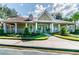 Community center building with well-maintained landscaping at 9481 Highland Oak Dr # 404, Tampa, FL 33647