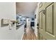 Inviting foyer with a wood floor, dining area, and open view into the living room at 9481 Highland Oak Dr # 404, Tampa, FL 33647