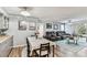 Combined living and dining area with luxury recliner seating and stylish decor at 9481 Highland Oak Dr # 404, Tampa, FL 33647