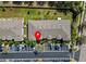 Overhead view of townhome building with well-maintained landscaping and ample parking spaces at 9873 Trumpet Vine Loop, Trinity, FL 34655