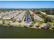 An aerial view of the townhouse complex and surrounding waterways at 9873 Trumpet Vine Loop, Trinity, FL 34655