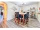 Dining room with modern light fixture and bar area at 9873 Trumpet Vine Loop, Trinity, FL 34655