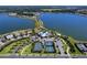 Beautiful community aerial showcasing lake, club, and tennis courts at 809 Seascape Pl, Sarasota, FL 34240