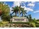Close up of the Shoreview at Lakewood Ranch Waterside community sign with flowerbeds and palm trees at 809 Seascape Pl, Sarasota, FL 34240