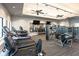 Well-equipped gym featuring modern machines, weights, and mirrored walls at 809 Seascape Pl, Sarasota, FL 34240
