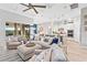 Inviting open-concept living area with comfortable seating, modern décor, and seamless access to the outdoor living space at 809 Seascape Pl, Sarasota, FL 34240