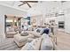Open-concept living space with a seamless flow between the kitchen, dining, and living areas at 809 Seascape Pl, Sarasota, FL 34240