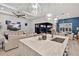 Open living space with a kitchen island, dining area, and living room with a ceiling fan at 809 Seascape Pl, Sarasota, FL 34240