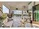 Relaxing patio with comfortable seating, views of the pool, and manicured landscaping at 809 Seascape Pl, Sarasota, FL 34240