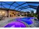 Inviting screened pool and spa area, with comfortable lounge chairs and outdoor dining, ideal for relaxation and entertaining at 809 Seascape Pl, Sarasota, FL 34240