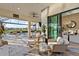 Relaxing poolside view showcasing comfortable seating, lush landscaping, and seamless access to the indoor dining area at 809 Seascape Pl, Sarasota, FL 34240