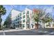 View of the modern, multi-story building with street access and visible signage at 101 N 12Th St # 306, Tampa, FL 33602