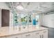 Modern kitchen with an island and large windows allowing for lots of natural light at 101 N 12Th St # 306, Tampa, FL 33602