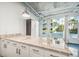 The kitchen boasts granite countertops and ample cabinet space with a window view at 101 N 12Th St # 306, Tampa, FL 33602