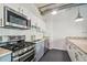 Bright kitchen boasts stainless steel appliances, granite countertops, and ample cabinet space at 101 N 12Th St # 306, Tampa, FL 33602