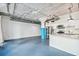 Open layout features concrete ceilings and modern kitchen, seamlessly blending living spaces at 101 N 12Th St # 306, Tampa, FL 33602