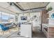 Bright and open living room and kitchen with modern furnishings and a view of the city at 101 N 12Th St # 306, Tampa, FL 33602