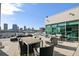 A rooftop deck with outdoor furniture and stunning views of the city skyline at 101 N 12Th St # 306, Tampa, FL 33602