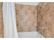 Inviting shower with neutral tile, sleek fixtures, and a luxurious showerhead enhancing the spa-like feel at 101 N 12Th St # 306, Tampa, FL 33602