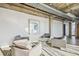 Modern sitting area with comfortable seating, a large window view, and industrial ceilings at 101 N 12Th St # 306, Tampa, FL 33602
