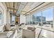 Modern sitting area with comfortable seating, an open ceiling, and an outdoor view to the city at 101 N 12Th St # 306, Tampa, FL 33602