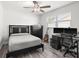 Bedroom featuring a bed, desk, and plenty of natural light, creating an ideal space for work and rest at 11098 Malaga Dr, Largo, FL 33774