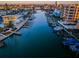 Aerial view of waterfront buildings, showcasing private docks, beautiful landscaping, and proximity to the Intracoastal Waterway at 11595 Gulf Blvd # 6, Treasure Island, FL 33706