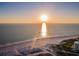 Panoramic view of the sandy beach and the Gulf of Mexico at sunset at 11595 Gulf Blvd # 106, Treasure Island, FL 33706